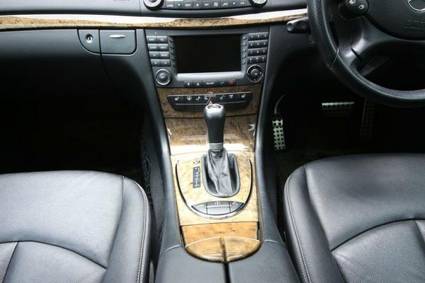 Polished wood trim decorates the cabin of the E550.