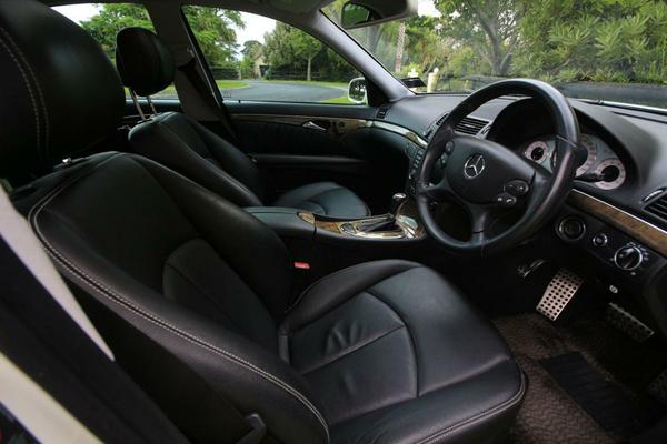 Our E550 is covered in a warm, rich black leather accented by polished wood trims.